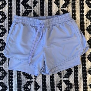 Light purple athletes shorts. Worn once, built in sliding shorts.